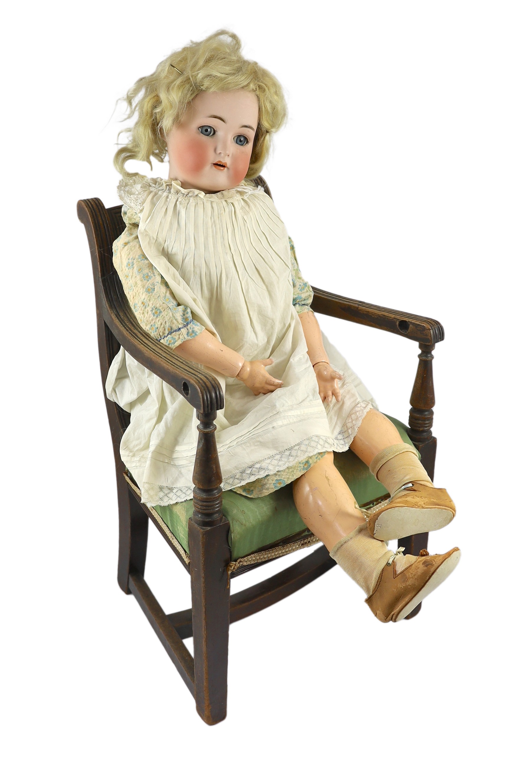 A Kammer & Reinhardt / Simon & Halbig bisque doll, German, circa 1892, 31in. Please note the chair is for display purposes only.
